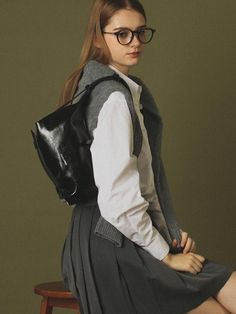 Composition : Shell: Vegan leather (artificial leather) 100% Lining: Polyester 100%Color : blackCountry of Origin : CHINA Black Leather Shoulder Bag For Fall, Chic Leather Backpack With Detachable Strap For School, Black Leather Shoulder Bag With Buckle Closure, Chic Leather Shoulder Bag Backpack, Black Leather Shoulder Bag For School, Black Leather Satchel Backpack For Work, Black Satchel With Buckle For Everyday Use, Black Leather Shoulder Backpack For Office, Modern Black Leather Backpack For Work