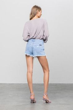 Ripped Frayed Denim Shorts- 100% Cotton- Non-Stretch Denim- Distressed Long Frayed Hem- Pockets- Imported, Designed In USASize S- Waist 30"- Hip 38"- Front Rise 10"- Leg Opening 24"- Inseam 3 1/2"Model wears size S, height 5'9"*For detail size spec, please message us* Style: Casual Print / Pattern: Light Wash Denim Silhouette: Long Fray Shorts Fit: High Rise Shorts Embellishment: Distressed Front Neck Line: N/A Sleeve: N/A Length: Shot Closure: Button Closure Lining: No Fabric Contents: 100% Cot Distressed Stretch Jean Shorts For Spring, Light Wash Ripped Relaxed Fit Bottoms, Ripped Cutoff Bottoms For Spring, Spring Stretch Cutoff Jean Shorts, Stretch Cutoff Jean Shorts For Spring, Light Wash Stretch Jean Shorts With Frayed Hem, Spring Light Wash Stretch Shorts, Stretch Jean Shorts With Frayed Hem In Light Wash, Light Wash Stretch Cutoff Jean Shorts