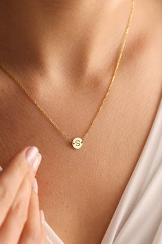 "Custom letter necklaces are perfect for all outfits. It is so dainty and chic with heart symbol. Here you will find the super elegant initial necklace with us. You may design your personalized jewelry necklace with any letter with a small heart just next to your/her letter. It has 3 different color so one is silver, one is gold and the other one is rose gold. It will look so nice on any women. We think that it is great gift idea for any women or mom.  The gold letter necklace is a durable solid necklace. First quality materials are used while producing our letter necklaces.  Our chains are produced by hand with a special system. It has a solid form. All our jewelry is %100 custom made by hand with Love and Care in our workshop! Nickel Free High Quality Materials Standard Deliver in 8-20 B Simple Initial Pendant Charm Necklaces, Simple Personalized Charm Necklace As Gift For Her, Simple Initial Pendant Name Necklace As Gift, Simple Initial Pendant Charm Necklace For Gift, Simple Initial Pendant Necklace As Gift, Simple Initial Pendant Necklace, Simple Initial Necklace For Personalized Gift, Simple Round Pendant Initial Necklace As Gift, Simple Round Initial Necklace As Gift