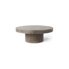 a round concrete table on a white background