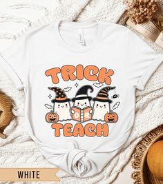 Get in the Halloween spirit with this festive teacher t-shirt! This shirt is sure to become one of your new holiday favorites. Here's what you can expect from this unique garment: -Heather and solid blend colors: 52% cotton, 48% polyester -Ash: 99% cotton, 1% polyester -Athletic Heather and Black Heather - 90% cotton, 10% polyester -Light-weight, breathable fabric with a retail fit -Unisex shirt -Tear away label -Crew neckline -Bella + Canvas brand .:CARE INSTRUCTIONS:. -Turn inside out -Machine wash on cold with mild detergent and similar colors -Tumble dry on low -Do not iron -Do not dry-clean .:HOW TO ORDER:. -Select color -Select size (price varies according to size) -Choose quantity -Add to cart -Checkout! .:SHIPPING & PROCESSING:. -Processed quickly and efficiently  -Ships in 2-5 bus Teacher Halloween, Teachers Halloween, Ghost Shirt, Teacher Tees, Halloween Spirit, Teacher Tshirts, Halloween T Shirt, Funny Halloween, Halloween Tshirts