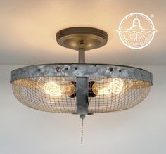 the light fixture is made out of metal and has two lights on each side of it