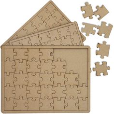 four pieces of jigsaw puzzle sitting on top of each other