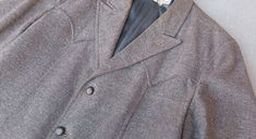 A vintage unicorn of a jacket! Made by one of the best vintage clothing manufacturers- Field and Stream Gordon Ferguson.  Medium brown wool tweed with a three button front, peak lapels, bakelite buttons, yoked back, bi-swing shoulders and buttoned saddlebag pockets. Excellent vintage condition with minimal wear. One arm cuff button is missing and there is some soiling around the inside neckline. It has not been cleaned. No noted moth holes, tears or other defects of any kind. Chest 44" Waist 42" Arm Shoulder to Cuff 25.5" Length 30" Field And Stream, Bakelite Buttons, Vintage Unicorn, Mens Sport Coat, Arm Cuff, Clothing Manufacturer, Medium Brown, Sport Coat, Vintage Clothing