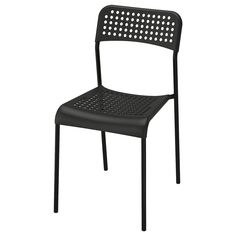 a black plastic chair with perfored back and seat, viewed from the side