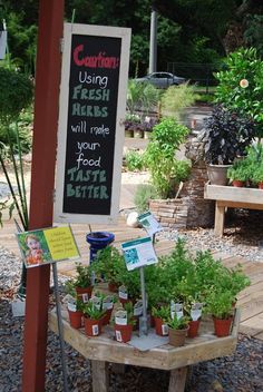 there is a sign that says garden using fresh herbs will relish your food better