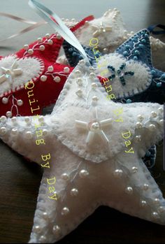 three white and red star ornaments on a table