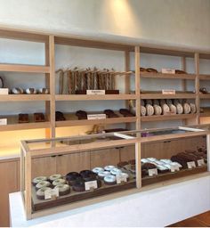 a display case filled with lots of different types of doughnuts and pastries