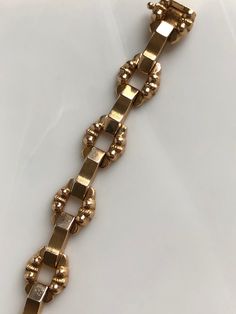 This is a beautiful vintage 18K Rose Gold Bracelet. It is a nice heavy weight. The center links are a satin finish and the rounded, decorative links are high polish. The length is 8 inches. The clasp is a slide with a safety lock on the side. Stamped 750 (18K) weight:19.21 grams Vintage, excellent condition 1970s original. With any pre-owned/Vintage/Antique items, it is common to have some wear, As we inspect each piece of our jewelry, we make sure the wear and tear is acceptable within industry Funky Rings, 21 Grams, Unisex Bracelets, Rose Gold Bracelet, Pink Bracelet, Green Tourmaline, Vintage Bracelets, Antique Items, Chain Link Bracelet