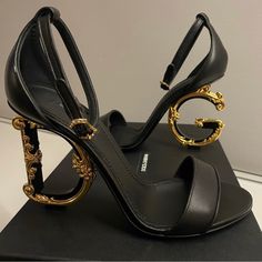 Brand New In Box - Size 38 Authentic Dolce And Gabbana Heeled Strappy Sandal / Pumps Never Worn With Beautiful D And G Forming The Heel Portion Of The Shoe. I Wish I Could Keep Them But They Are Too Big For Me :( I Hope They Will Go To Someone Soon So They Can Be Worn And Enjoyed! D&g Shoes, Brown Designer Heels, Cute Designer Shoes, Buchona Shoes, Designer Heels For Formal Occasions, Luxury Round Toe Heels For Gala, Luxury Evening Heels, Dg Heels, Black Designer Heels