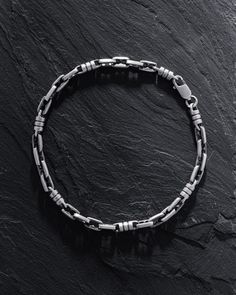 Introducing the Silver Bracelet TID ROM, a piece that encapsulates the essence of "time and space" in its design. The name itself, where "Tid" translates to "time" in Scandinavian languages and "Rom" signifies "space" or "free space", embodies the notion of striking a balance between the dynamic flow of time and the serene expanse of space in our lives. More than just an accessory, the TID ROM bracelet serves as a poignant reminder of the importance of carving out time for oneself and cherishing Link Bracelet With Sterling Silver Clasp, Metal Link Bracelet With Sterling Silver Clasp, Silver Sterling Bracelets With Rectangular Links, Silver Sterling Bracelet With Rectangular Links, Silver Bracelets With Rectangular Links And Sterling Clasp, Modern Silver Link Bracelet, Modern Silver Bracelet With Hook And Links, Classic Sterling Silver Bracelets With Hook And Links, Sterling Silver Jubilee Bracelet With Rectangular Links