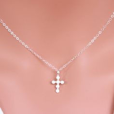 "Sterling Silver Cross Necklace - Religious Jewelry - Tiny Sterling silver CZ Cross Necklace - Layering Necklace Dainty Cross Necklace - Gift for Her ★★The necklace makes of .... -Sterling Silver 9.4x17.5mm Small CZ Cross Pendant, 3.2mm Closed Ring Sterling silver cable chain with spring claw . -Total length will be 16\" 17\" 18\" or 19\" depend on customer request. -Come up with beautiful ribbon gift box -One set of care instruction package that enhance your present ... All quantities are avail White Sterling Silver Spiritual Charm Necklaces, Spiritual White Sterling Silver Charm Necklace, Sterling Silver Cross Necklaces For Mother's Day, Silver Cross Jewelry For Mother's Day, Spiritual Cross Necklace With Silver Chain For Gift, Elegant Silver Cross Necklace For Wedding, Silver Cross Pendant Jewelry For Mother's Day, Silver Cross Pendant Necklace For Mother's Day, Sterling Silver Cross Pendant Jewelry Gift