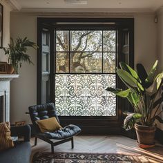 a living room filled with furniture and a large window covered in filigrees