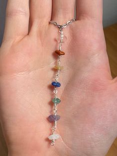 This Rainbow gemstone necklace features multicolored strand of raw crystals- each of the 7 chakra stones. From bottom to top, this strand includes clear quartz, red jasper, yellow jade, sodalite, aventurine, amethyst, and rose quartz <3 Strand is topped with clear crystal quartz for its amplification, divine energy and clarity. Why you should wear chakra crystals: Chakra jewelry helps positive vibrations reach inside the deepest parts of the body. Energy moves through the body and opens up the n 7 Chakra Stones, Amethyst And Rose Quartz, Positive Vibrations, Divine Energy, Raw Crystals, Rainbow Gemstones, Yellow Jade, Body Energy, Rainbow Necklace