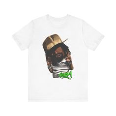 Elevate your style with our exclusive THIZZY shirt. Crafted for true hip hop fans, this tee merges comfort with Mac Dre's swag. Embrace the vibes of this rap legend and make a statement wherever you go. This classic unisex jersey short sleeve tee fits like a well-loved favorite. Soft cotton and quality print make users fall in love with it over and over again. These t-shirts have-ribbed knit collars to bolster shaping. The shoulders have taping for better fit over time. Dual side seams hold the garment's shape for longer.  .: 100% Airlume combed and ringspun cotton (fiber content may vary for different colors) .: Light fabric (4.2 oz/yd² (142 g/m .: Retail fit .: Tear away label .: Runs true to size Pre-shrunk Hip Hop Tops For Streetwear, Hip Hop Graffiti Print T-shirt For Streetwear, Urban Shirt With Graffiti Print For Streetwear, Urban Graffiti Print Shirt For Streetwear, Urban Pre-shrunk Streetwear Shirt, Urban Pre-shrunk Shirt For Streetwear, Urban Style Pre-shrunk Shirt For Streetwear, Hip Hop Tops With Sublimation Print For Streetwear, Hip Hop Style Screen Print Shirt For Streetwear