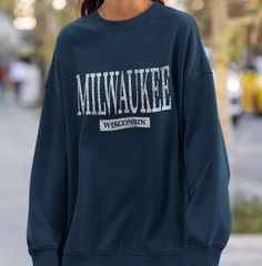 Milwaukee Wisconsin Sweatshirt, Womens Unisex Wisconsin Crewneck Shirt Gift Design has been distressed for a vintage look. The sweatshirts in the pictures are solid color heavy weight with soft fleece inner lining. They are not pigment-dyed or vintage. .: 50% Cotton 50% Polyester .: Medium-heavy fabric (9.9 oz/yd²) .: Loose fit .: Sewn in label .: Runs true to size PROPER SIZING Please see photos to see a specific sizing chart for this shirt style. These shirts are unisex size, meaning they are not women's fitted shirts. If would like a more fitted look, we suggest that you size down. To get your size, lay your favorite shirt at home flat, measure armpit to armpit, and then compare to the size chart in the photos. CARE INSTRUCTIONS Machine wash cold, inside-out, gentle cycle with mild dete Wisconsin Crewneck, Wisconsin Sweatshirt, Letter Shirt, Bubble Letter, Fitted Shirts, Gift Design, Milwaukee Wisconsin, Crew Neck Shirt, Life Design