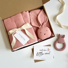 a pink baby gift set in a box