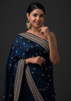 COLOR : Oxford Blue & Beige Gold FABRIC : Saree - Art Silk, Blouse - Gota WORK : Dori Work, Stones, Sequins & Lace BorderOCCASION : Wedding, Engagement, Party Wear, Festival, Sangeet NOTE : The outfit includes blouse and saree only. Petticoat is not included. READY-TO-WEAR : No STITCHING : Available as semi-stitched fabric, can be stitched using standard size option (+$20). Note: There might be a slight color variation due to lighting and flash used during photoshoot. The bright shade seen is th Navy Blue Saree, Blue Silk Saree, Set Saree, Oxford Blue, Blue Saree, Embroidery Saree, Art Silk Sarees, Red Saree, Saree Trends