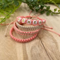 "These macrame bracelets made of the waxed cord are waterproof and adjustable. They are the perfect friendship bracelets. These custom bracelets were designed for everyday wear. This minimalist boho beige and peach cord bracelet enhances your casual outfit. ♥ ITEM DETAILS: Total length: The size of the bracelet is adjustable. 💕The bracelet has an adjustable closure that will work on a wrist of about 6 - 7\"💕 Materials: Waxed cord - Acrylic Initial Charm Charm Color Available: White and Gold Wa Trendy Handmade Friendship Bracelets For Mother's Day, Handmade Pink Nylon Cord Friendship Bracelets, Casual Personalized Braided Bracelet For Friendship, Adjustable Pink Friendship Bracelets With Custom Name, Adjustable Casual Friendship Bracelets For Birthday, Bohemian Adjustable Friendship Bracelets For Mother's Day, Adjustable Bohemian Friendship Bracelets For Mother's Day, Adjustable Bohemian Friendship Bracelet For Mother's Day, Personalized Pink Bohemian Friendship Bracelets