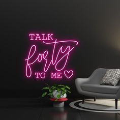 a neon sign that says talk forty to me on the wall next to a chair