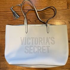 Approximately 15in Wide And 12in Tall Vinyl Like Material Victoria's Secret Beige Shopping Bag, Beige Victoria's Secret Shopping Bag, White Rectangular Victoria's Secret Shoulder Bag, Victoria's Secret White Shoulder Bag For Daily Use, Everyday Beige Victoria's Secret Bag, Casual White Victoria's Secret Bag, Victoria's Secret White Bags For Everyday Use, Victoria's Secret White Rectangular Bag, White Rectangular Victoria's Secret Bag