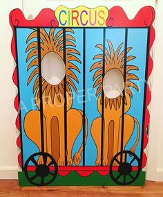 an image of a circus game on the floor in front of a door with two lions behind bars