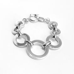 Classic round link bracelet in high polish, solid 950 Sterling silver. The largest link is centered. Makes a statement! Comes with a round safety latch clasp. Also available in Toggle clasp – please contact us if you wish for the latter.Bracelet length 8 inches.Gift boxed Sterling Silver Bracelet, Toggle Clasp, Infinity Bracelet, Sterling Silver Bracelets, Link Bracelets, Silver Bracelet, Jewelry Bracelets, Bracelet, Sterling Silver