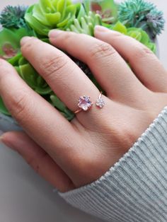 "Bubble Sakura Wrap Band Ring Band Width: 1/16\" (0.1 cm) to 5/16\" (1.0 cm) can also go wider depends on how you want to style the ring. Will fit 5.5 to 8.5 US ring size Weight: 2g Material: Rhodium or Rose Gold plated over brass, cubic zirconia Note: Please stretch the ring out with care. Do it slowly to get to the size that you need. Too much force would put stress on it and snap. To make it smaller just pitch it together." Sakura Engagement Ring, Dainty Pink Flower Promise Ring, Dainty Pink Open Heart Ring, Dainty Pink Heart Open Ring, Adjustable Pink Flower Ring For Anniversary, Adjustable Open Flower Ring Fine Jewelry, Pink Dainty Birthstone Promise Ring, Dainty Pink Birthstone Promise Ring, Delicate Pink Open Ring Jewelry