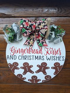 a gingerbread kisses and christmas wishes sign