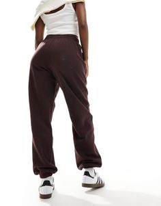 Sweatpants by adidas Originals For 'no plans' plans Elasticized waistband Functional pockets Logo embroidery Regular, tapered fit Brown Relaxed Fit Sporty Activewear, Sporty Brown Sports Pants, Brown Athleisure Pants For Loungewear, Brown Sporty Activewear With Elastic Waistband, Brown Relaxed Fit Joggers For Streetwear, Brown Cotton Joggers For Streetwear, Brown Sweatpants For Streetwear In Fall, Athleisure Brown Pants For Fall, Brown Athleisure Pants For Fall