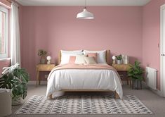 a bedroom painted in pale pink and white, with a bed on the far side