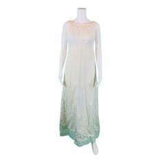 A vintage 1960s formal gown with a white lining, cream lace overlay, empire bust, scoop back, attached bow with a train and an a-line skirt. Zips up the back with a metal zipper. LABEL: - FABRIC: - SHOULDERS: 15" SHOULDER TO WAIST: 11" BUST: 36" WAIST: 31" HIPS: 37" LENGTH: 56.5" CONDITION: good, sold AS IS, has discoloration at underarms and on empire bodice lining, discoloration on lining, tear in lining at bottom, bow is held on with safety pins, muslin lining inside skirt, discolored  PINNED A-line Lace Dress For Evening, Lace A-line Formal Maxi Dress, Lace Gown With Lace Trim For Evening, Vintage A-line Wedding Evening Dress, Floor-length Lace Dress For Vintage Events, Evening Cream Lace Maxi Dress, Vintage A-line Maxi Dress For Wedding, Vintage Lace Maxi Dress For Wedding, Vintage Lace Evening Dress For Formal Occasions