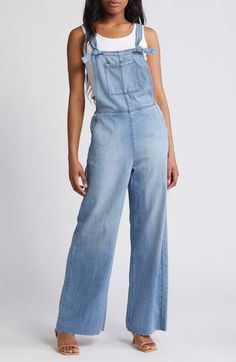 Raw hems give lived-in appeal to these laid-back overalls cut with a relaxed, straight-leg fit. 29" inseam Square neck Adjustable buckle straps 73% cotton, 27% rayon Machine wash, tumble dry Imported Casual Cotton Overalls With Belt Loops, Light Wash Cotton Denim Jumpsuit With Frayed Hem, High Rise Cotton Overalls, Spring Light Wash Straight Leg Overalls, Cotton Overalls With Frayed Hem, Casual Denim Jumpsuit With Belt Loops For Work, Spring Denim Jumpsuit With Belt Loops, Casual Spring Overalls With Belt Loops, Utility Style Washed Denim Jumpsuit With Straight Leg