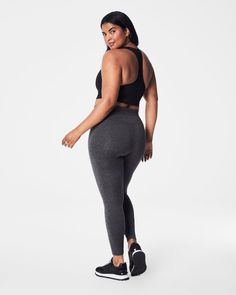 Our cozy, peachy-soft high-rise leggings feature a built-in waistband that gently smooths your curves with light core compression—plus an adjustable tunnel drawstring for the perfect fit. Made with super-soft fabric with 4-way stretch in a heathered, tonal design, these leggings are enhanced with strategically placed and engineered back-v-seaming that defines the booty. The result? A look that suits low-impact movement and just-as-easygoing outings.​ | Spanx Women's SPANXsmooth SoftStretch High-Rise Leggings Sporty 4-way Stretch Tights For Loungewear, Sporty Tights For Loungewear With 4-way Stretch, Sporty Loungewear Tights With 4-way Stretch, Functional 4-way Stretch Leggings For Loungewear, High Rise Leggings, Soft Fabric, Soft Fabrics, Perfect Fit, Built In