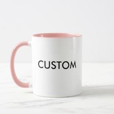 a red and white coffee mug with the word custom printed on it's side