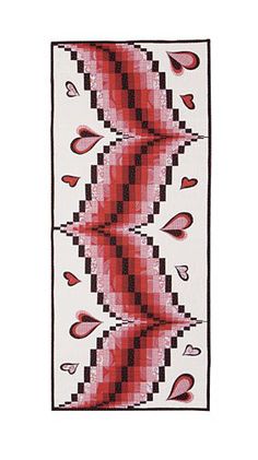 a cross stitch pattern with red and black hearts on it's side, in the shape of an arrow