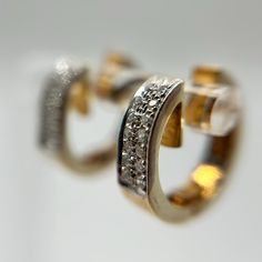 These 14K Yellow Gold Huggie Hoop Earrings are the perfect blend of elegance and sophistication. Each earring features a sleek, polished gold design adorned with a row of sparkling diamond accents that add a touch of brilliance and luxury. Measuring 16.4mm x 4.4mm and weighing 6.53 grams, these earrings are substantial yet comfortable for daily wear. The huggie style ensures a secure fit, making them a versatile choice for any occasion, from casual outings to formal events. With their timeless appeal, these earrings are a must-have addition to any jewelry collection, offering a classic look with a contemporary twist. Modern Oval Huggie Earrings For Anniversary, Elegant Huggie Rings With Diamond Accents, Modern Round Huggie Earrings With Prong Setting, Diamond Huggie Earrings With Polished Finish, Classic Diamond Accented Huggie Earrings For Anniversary, Modern Hallmarked Huggie Earrings, Elegant Huggie Hoop Earrings With Polished Finish, Formal Huggie Earrings With Diamond Accents, Formal Oval Huggie Earrings With Polished Finish