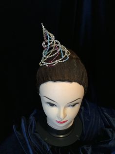 This wonderfully hat ballet headpiece is create with Silver,white pearls,crystal, yellow,light blue and fuchsia Swarovski pearls and bicone .And also rocailles Miyuki beads. Unique pieces hand made with high quality materials, which last in the years. To each single piece is applied a double work, made with a metallic wire and then for safety with a nylon thread that gives resistance. It can be used for Arlequinade ballet variations. It can be personalised in any colour you want. High 9cm Diamet Whimsical Tall Crown Headpiece For Carnival, Carnival Crown Headpiece For Mardi Gras, Crown Headpiece For Mardi Gras Carnival, Whimsical Crown Costume Hat For Carnival, Mardi Gras Carnival Crown Headpiece, Carnival Round Crown Headpiece, Whimsical Crown Headpiece For Carnival, Whimsical Carnival Crown Headpiece, Carnival Structured Crown Headpiece