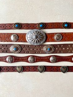 Vintage Concho Belt CHOOSE ONE, Western Leather, Sterling, Silver, Turquoise, Brass, heart, Justin   ....CHOOSE ONE (of 5) Vintage Belts:  1) Brass Buckle, stay, Brown pierced gen Leather, Turq Floral Concho, 40x 7/8" 5 holes: 33-37", size M, $62  2) Silver scroll floral Buckle, stay, Brown gen Leather floral emboss studded, Silver Concho, 38x 1 1/4", 5 holes: 30.5- 35", size M, $128  3) Silver/Copper Buckle, stay, wide Brown floral pierce Leather, Silver Turq ovals, 37.5x 1 3/8",poke 31.5-34", Concho Leather Belt, Concho Belt, Vintage Belt Buckles, Heart Flower, Leather Floral, Western Leather, Vintage Belts, Gold Branding, Brass Buckle