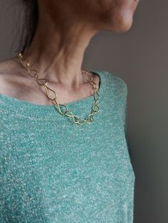 Made of brass. Hand textured. The chain is twisted for a special touch. Can be adjusted. Approximate length from end to end: 50 cm Formal Adjustable Brass Chain Necklace, Elegant Oval Link Metal Chain Necklace, Elegant Oval Link Chain Necklace, Chic Gold Brass Chain Necklace, Formal Long Brass Chain Necklace, Chic Metal Cable Chain Necklace, Long Brass Chain Necklace, Chic Metal Chain Necklace With Cable Chain, Elegant Brass Chain Necklace With Adjustable Chain