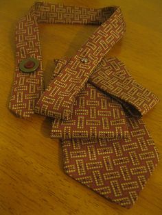 three ties laid out on a wooden table