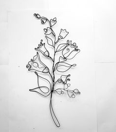 Totally handmade wire sculpture, made from black steel wire. This leaf is ready to ship, and if you want custom made flower arrangement, just message me. All my wall flowers, single flowers and bouquets are made of wire of different diameters - 0.8-2 mm. I use only hard wire, not aluminium, so this flowers are not delicate and hold their shape. I also do a little blacksmiths, hammering out my sculptures to give them more finished look. As it is impossible to make manually all items identical - they are all one of a kind. All my works are painted. For compact and sustainable shipment, flowers  are bent into circle and wrapped in the eco-friendly and old-fashioned way with paper and string.(When unpacking, be patient and careful as the flowers sometimes cling to each other) ! Please be caref Wire Leaf, Flowers Single, Leaf Wall Decor, Sculpture Wire, Single Flowers, Wall Decor Unique, Wall Flowers, Wire Flowers, Metal Wall Sculpture