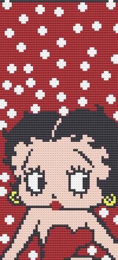 a cross stitch pattern with a woman's face in red and white polka dots