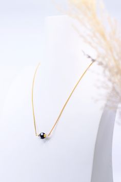 We all have someone who we treasure so much that we want to give them all the best. This Filhota necklace is crafted with just one single Konta D'oju bead, symbolizing "you are the special one." This simply designed necklace can be easily layered with others or wear on its own.- Handmade by Alzerina in the USA Minimalist Solitaire Necklace As Gift, Gift Crystal Long Necklace With Beaded Chain, Delicate Chain Crystal Choker Necklace For Gift, Gift Long Crystal Necklace With Beaded Chain, Crystal Choker Necklace With Delicate Chain For Gifts, Long Beaded Chain Necklace As Gift, Spiritual Beaded Chain Necklace With Round Pendant, Crystal Necklaces With Delicate Chain And Round Beads, Gift Crystal Necklaces With Delicate Chain And Round Beads