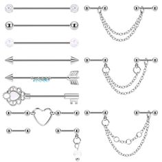 a set of different piercings with chains and hearts on them, including an arrow