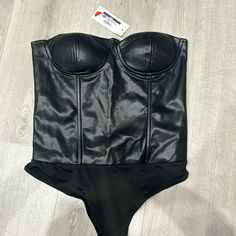 Never Worn, Tags On. Fits More Like A Medium Black High Waist Corset For Party, Black Strapless Bodysuit For Club, Strapless Black Bodysuit For Club, Chic Black High Waist Corset, Chic Black High-waist Corset, Chic Black Corset With Lined Body, Black Strapless Bodysuit For Evening, Bustier Bodysuit, Corset Bodysuit