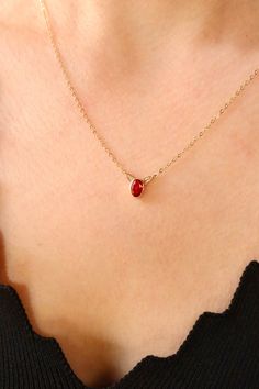 Elevate your style with this exquisite 14K gold necklace featuring a captivating red gemstone pendant. The deep, rich hue of the ruby exudes timeless beauty, making it a perfect accessory for various occasions. Handcrafted with precision, this chic and stylish necklace adds a touch of sophistication to any ensemble. Whether you're attending a special event or simply want to enhance your everyday look, this red stone jewelry is a symbol of classic charm and enduring elegance. Key Features: Material: 14K Gold Dazzling ruby gemstone pendant Handcrafted for a unique touch Classic and timeless design Perfect for any occasion Classic Red 14k Gold Necklace, Elegant Ruby Oval Pendant Necklace, Elegant Ruby Necklace With Oval Pendant, Fine Jewelry Red Gemstone Birthstone Necklace, Red Birthstone Necklace In Fine Jewelry Style, Fine Jewelry Red Birthstone Necklace, Red Gemstone Birthstone Necklace Fine Jewelry, Formal Ruby Necklace With Oval Pendant, Classic Necklace With Lab-created Ruby Gemstone