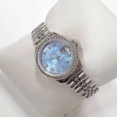 Women's Rolex 26mm DateJust Stainless Steel Watch with Powder Blue Diamond Dial and Diamond Bezel. Pre-Owned Brand: Rolex. Crystal: Sapphire. Dial: Diamond Dial. Gender: Women's. Dial Color: Powder Blue. Movement: Self-Winding. Case Dimensions: 26mm. Metal Type: Stainless Steel. Bezel: Custom Diamond Bezel. Bracelet / Strap: Original Jubilee. Box / Certificate: Rolex Box / Certificate of Authenticity. Service Warranty: One (1) Year Limited Service Warranty. NOTE: This beautiful Rolex watch inclu Blue Diamond Chronometer Watch For Formal Occasions, Formal Blue Diamond Watch With Chronometer, Blue Diamond Watch With Round Dial, Blue Diamond Watch With Diamond Hour Markers For Anniversary, Blue Diamond Watch For Anniversary, Blue Diamond Watch With Round Subdials, Blue Diamond Watch With Subdials, Timeless Blue Diamond Watch With Chronometer, Blue Diamond Watch With Diamond Hour Markers