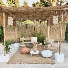 an outdoor area with wicker furniture and plants