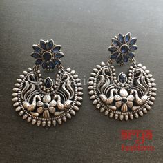 Silver Oxidized Chandbali Studs, Indian Trendy Earrings Made in Brass with Oxidized Silver Finish and colored stones Very Elegant and stylish, these earrings can be paired with any traditional Indian or Western Attire depending upon the occasion and the theme. Length: Approx. 2.25 Inches Light-weight Earrings come with Push Back Closure In-stock & ready-to-ship **Color may vary slightly due to photography and lighting. Pick-up available for this item at 5336 Heather Brook Ln. Glen Allen, 23059, Oxidized Finish Earrings For Diwali Celebration, Traditional Oxidized Hoop Earrings For Festive Occasions, Festive Oxidized Finish Hoop Earrings, Elegant Oxidized Earrings For Diwali, Silver Temple Jewelry Hoop Earrings, Blue Temple Jewelry Earrings For Diwali, Festive Round Hoop Earrings With Oxidized Finish, Elegant Oxidized Chandbali Hoop Earrings, Diwali Temple Jewelry Earrings With Oxidized Finish